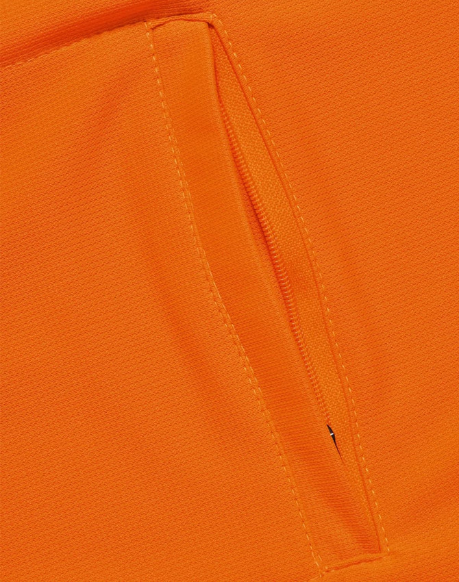 An orange polo shirt featuring a vented design and a zippered pocket. The fabric appears breathable and lightweight.