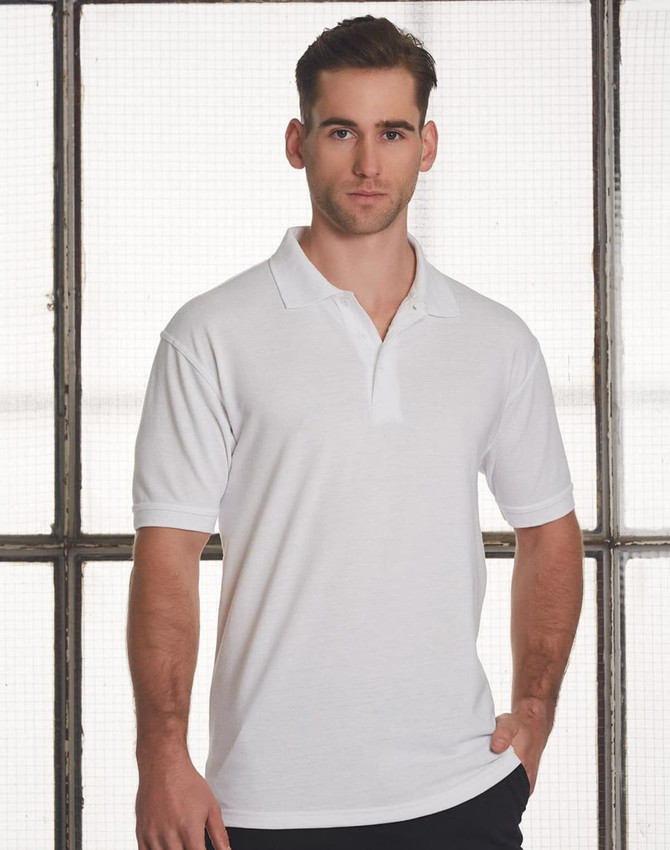 A man models a short-sleeved white polo shirt with a collar and logo on the chest.
