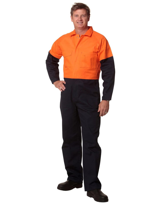 A man is wearing a Hi-Vis two-tone cotton drill coverall, featuring orange and navy blue colours. It has a logo.