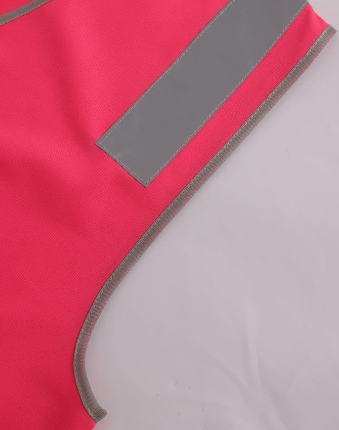 A bright pink safety vest featuring reflective shoulder tapes and contrasting grey edging. It includes a logo.