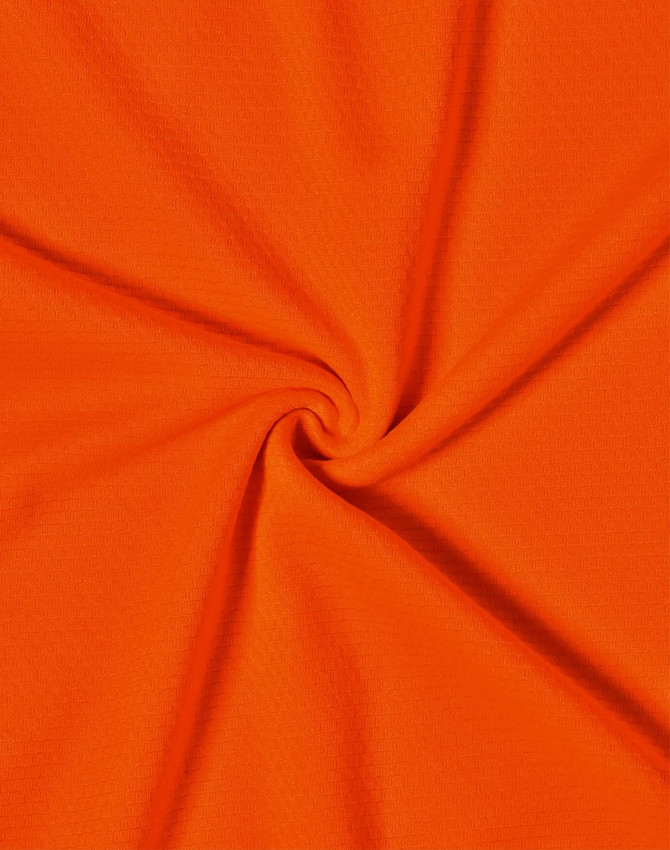 An orange fabric featuring a smooth texture, suitable for work polo shirts. It has a vibrant hue and a soft appearance.