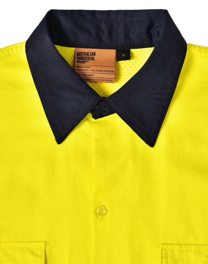 A Hi-Vis long sleeve safety shirt in bright yellow with a dark navy collar, featuring a label and button closures.