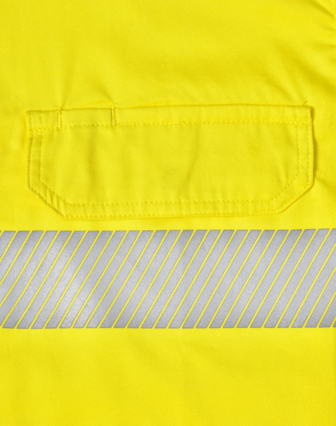 A bright yellow safety shirt featuring segmented reflective tape and a pocket. It has a logo on the fabric.