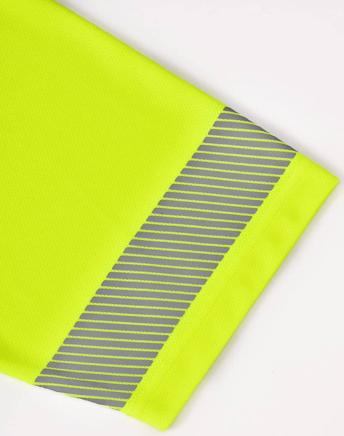 A bright yellow polo shirt featuring a segmented reflective strip on the sleeve. It has a logo on it.