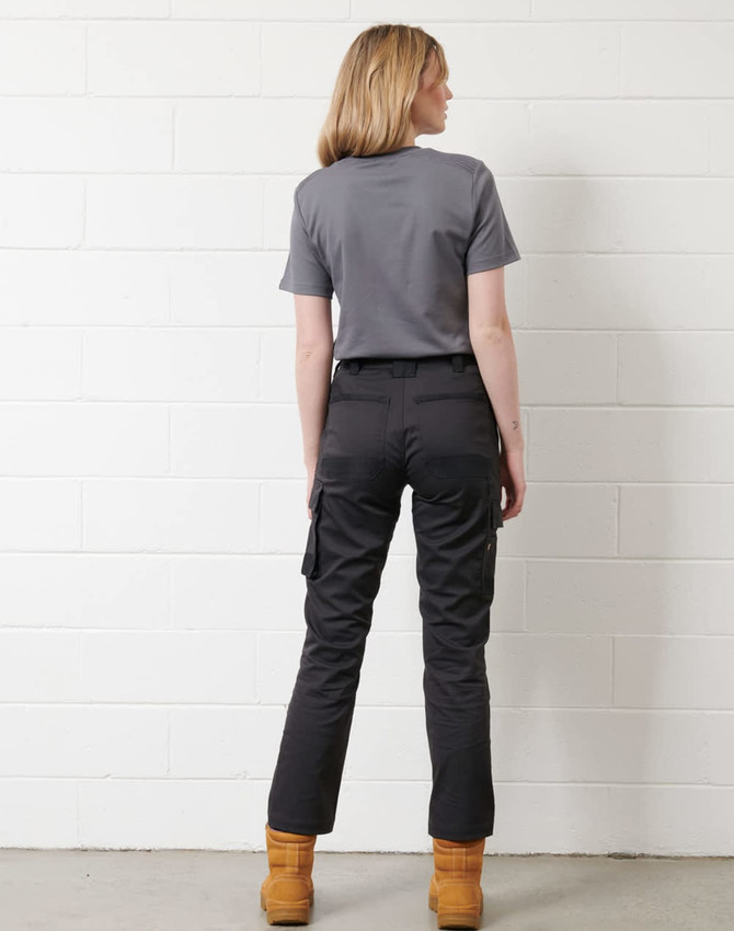 A model wearing a grey short-sleeve work T-shirt paired with black trousers and tan work boots.