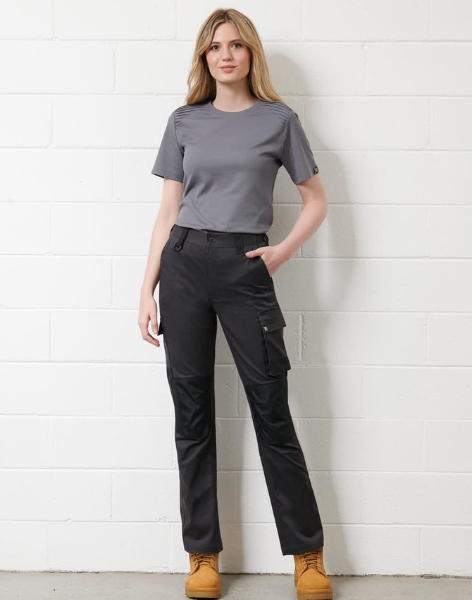 A grey short-sleeve t-shirt paired with black work pants, worn by a model standing against a white wall.
