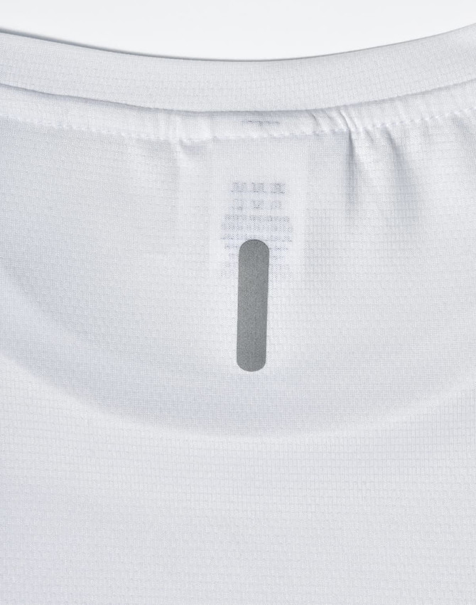 A white lightweight performance t-shirt featuring a label at the neckline and a simple design.