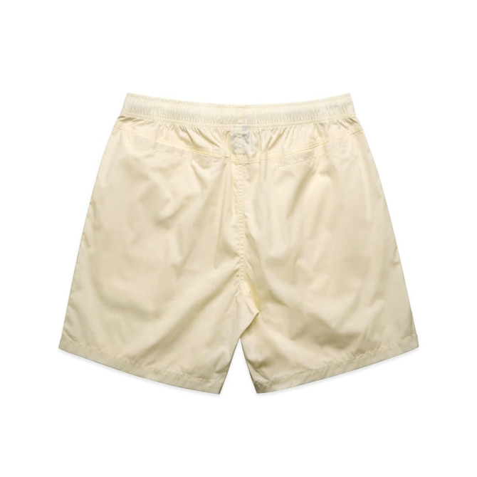 Cream-coloured beach shorts featuring an elastic waistband and a simple design. Includes a logo.