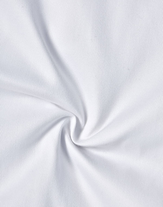 A close-up view of white fabric with a subtle texture, showing a spiral pattern in the material.