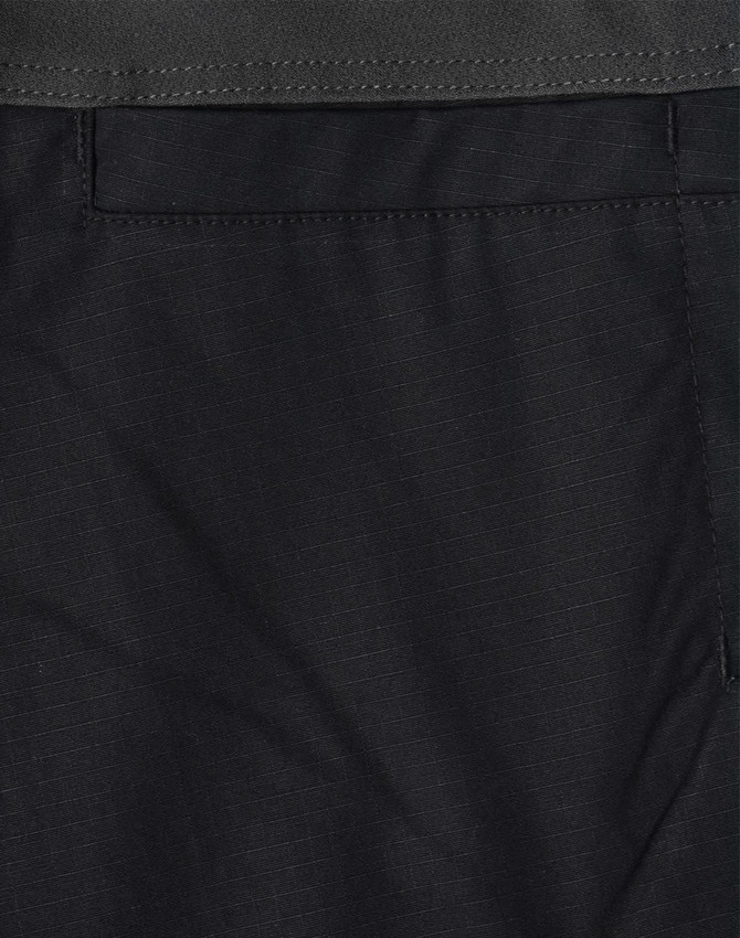 Black rip-stop poly/cotton stretch work pants with a subtle textured pattern and a pocket detail.