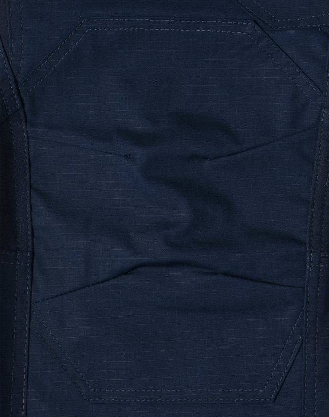 A close-up of dark navy rip-stop poly/cotton stretch work pants, featuring textured fabric and detailed stitching.
