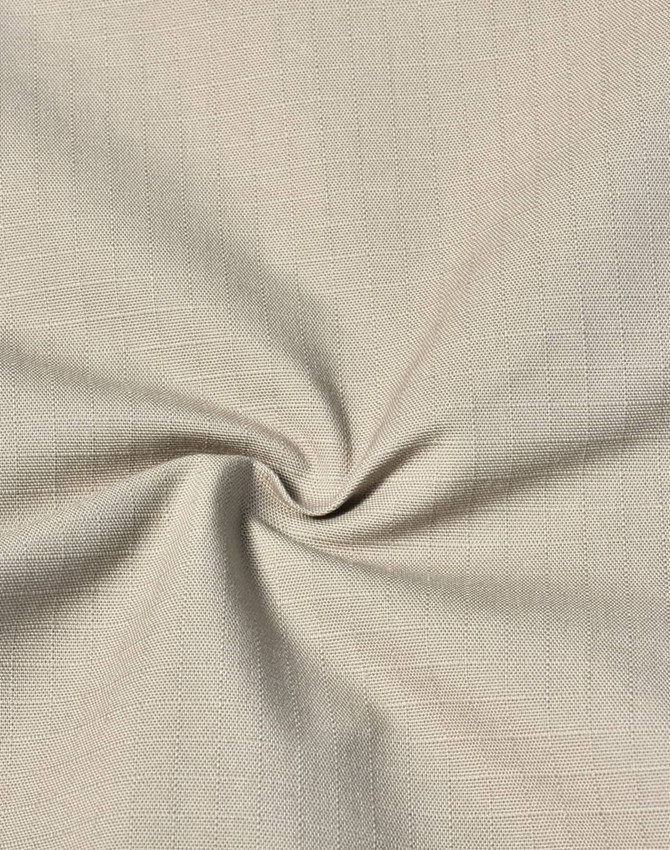 A close-up of rip-stop fabric in a light beige hue, showing its texture and pattern. The fabric is soft and durable.