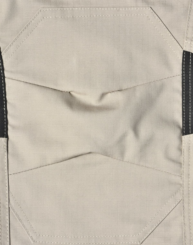 Light grey fabric of work pants featuring detailed stitching and black accents, with a logo present.