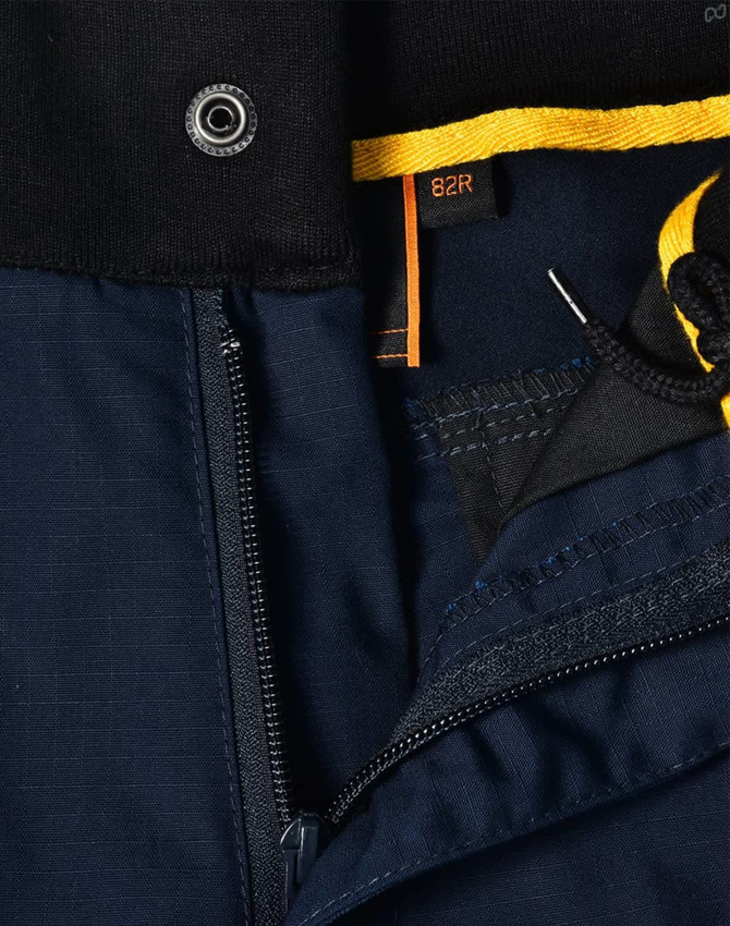 Close-up of navy blue Rip-Stop Poly/Cotton Stretch Work Shorts featuring a zipper and detailed stitching.