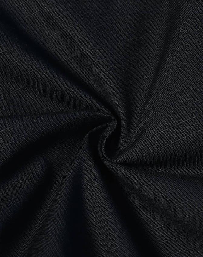A close-up of black fabric showcasing a rip-stop texture, suitable for work shorts. The material has a soft, stretchy quality.