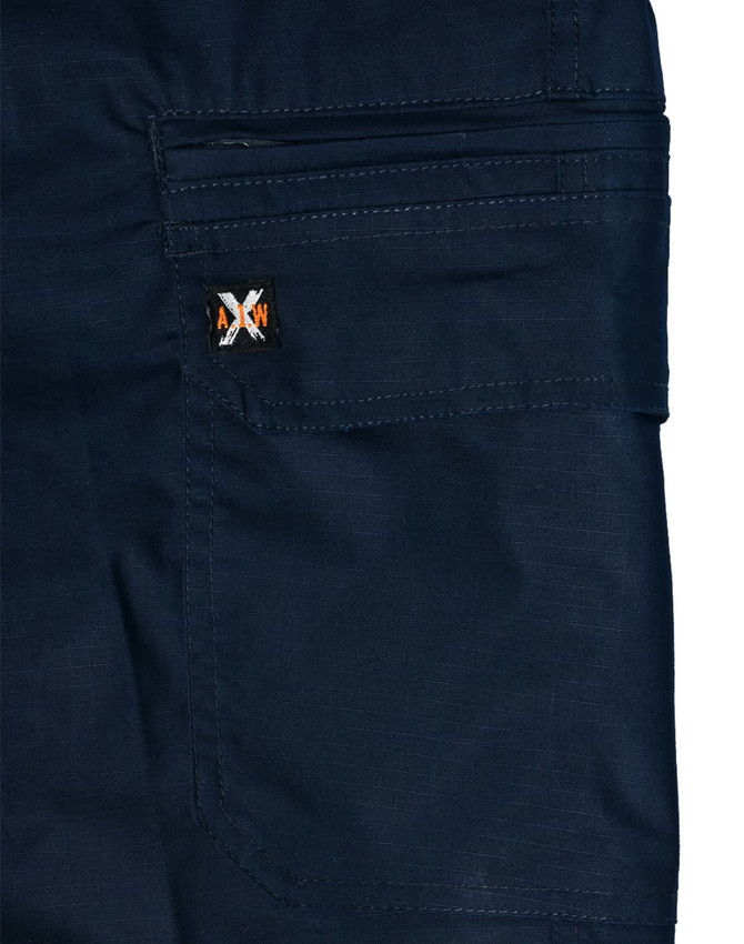 Navy blue work shorts featuring a pocket and a logo patch. Made from rip-stop poly/cotton stretch material.