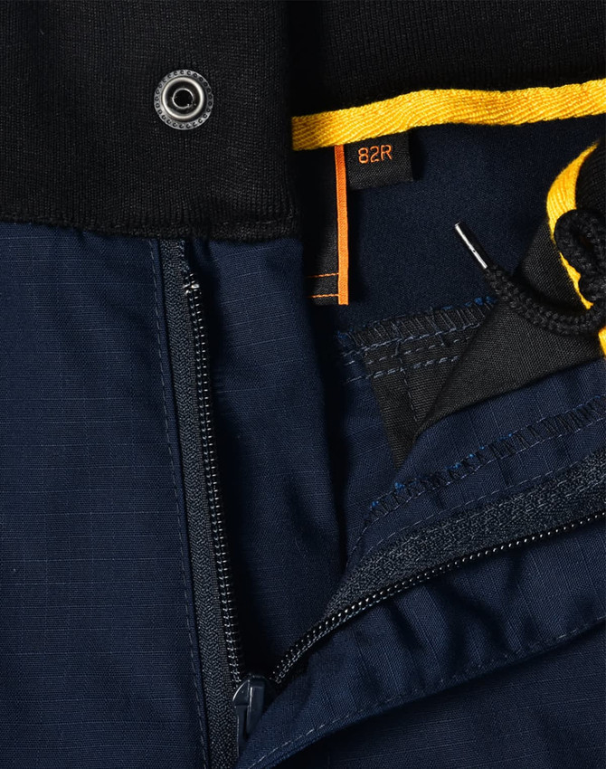 Close-up of navy blue Rip-Stop Poly/Cotton Stretch Work Shorts featuring a zipper and detailed stitching.