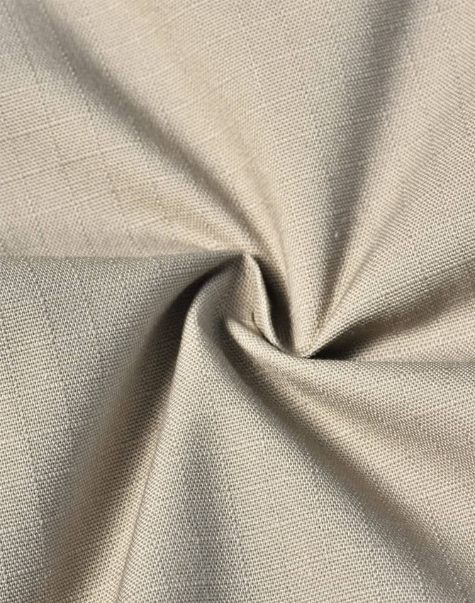 A close-up of rip-stop fabric in a light beige colour, featuring a textured weave. The image displays the fabric's flexibility.