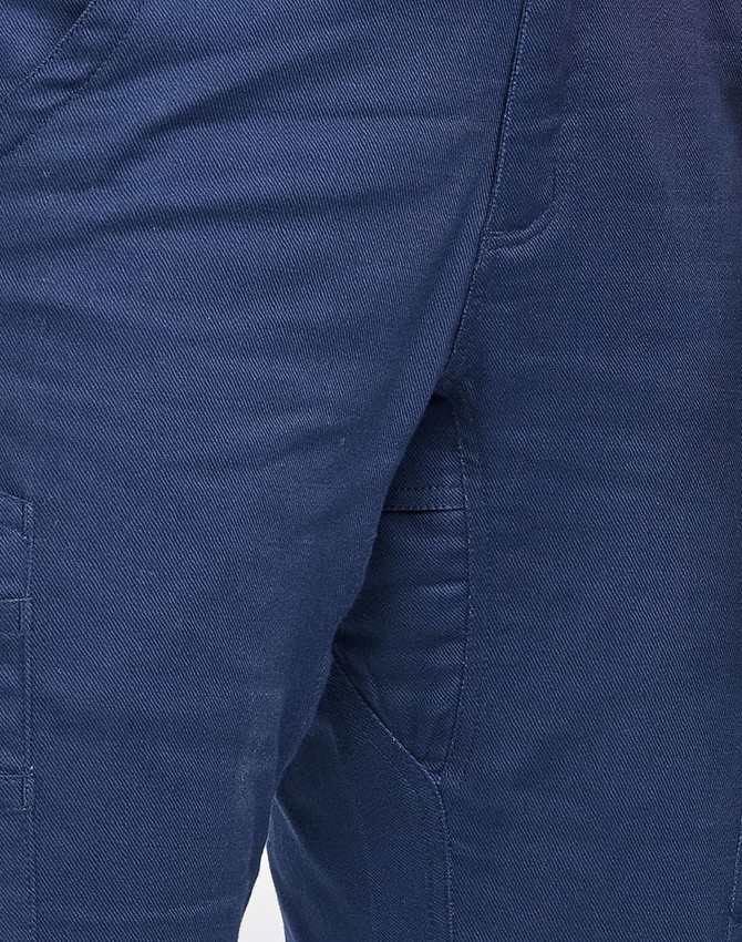 Unisex cotton stretch ripstop work pants in navy blue, featuring side pockets and a logo.