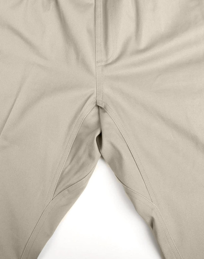Unisex cotton stretch drill cuffed work pants in a light beige colour, featuring a flexible design and logo.