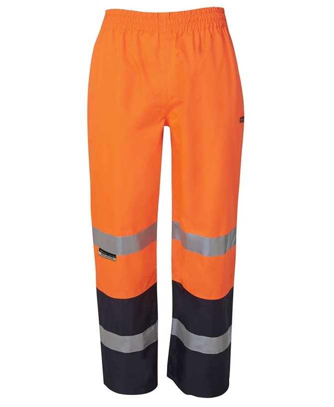 Premium rain pants in bright orange with reflective stripes and a black base, featuring an elastic waistband.