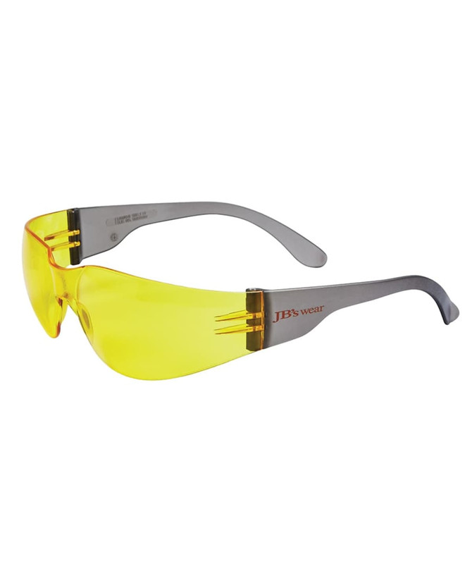 A pair of sunglasses with a grey frame and yellow lenses, featuring a logo on the arm.