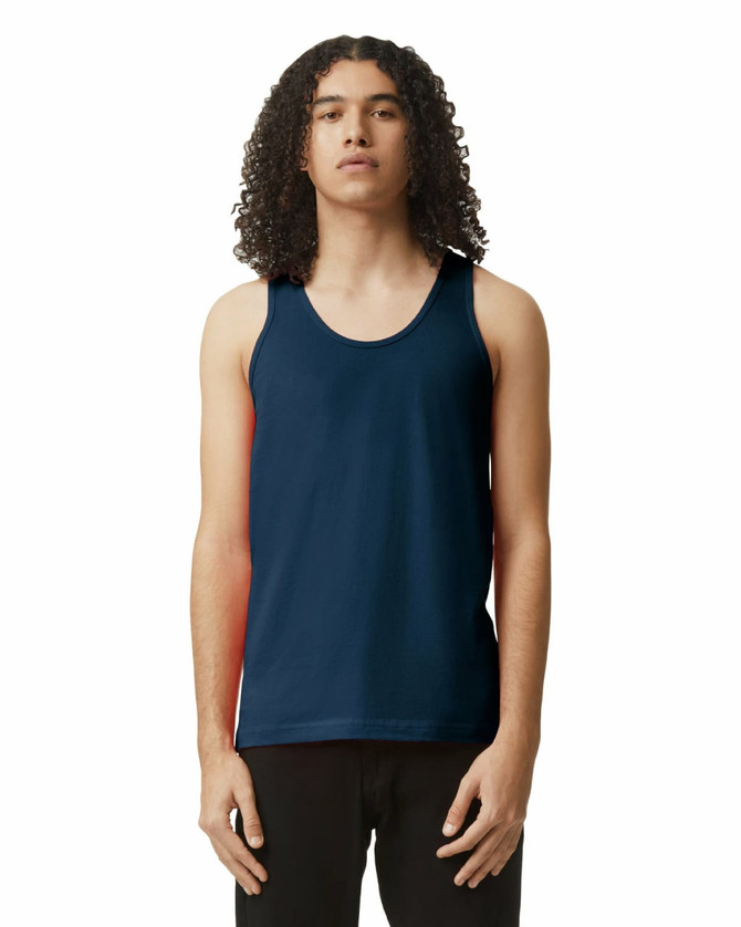 A unisex fine jersey tank in navy blue with a logo, worn by a model standing straight.