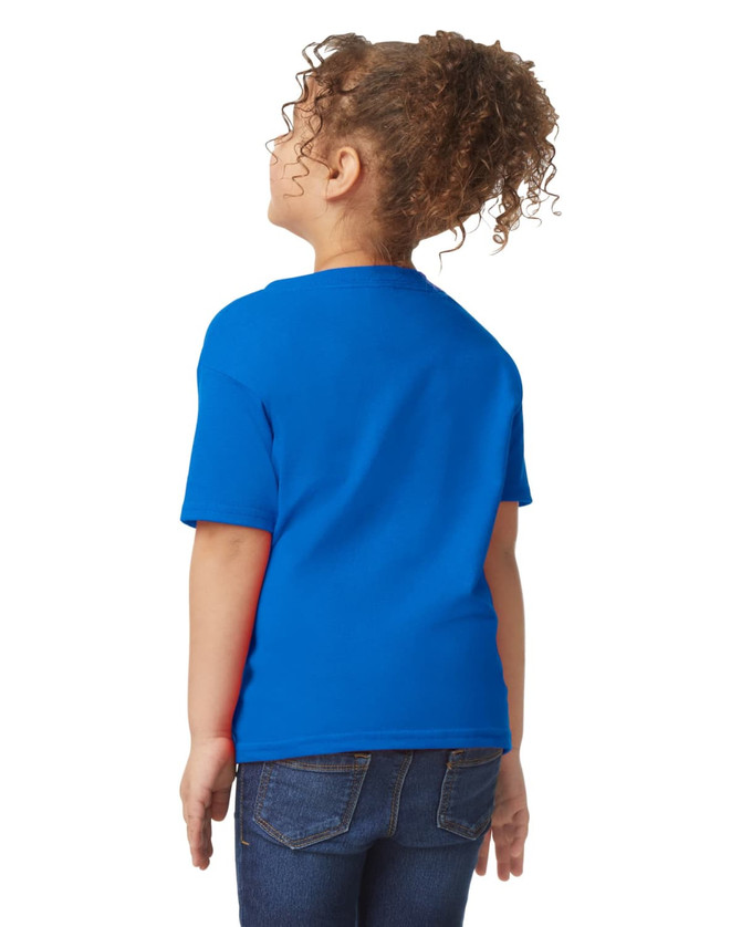 A toddler wearing a blue Gildan Heavy Cotton T-shirt, viewed from the back, with curly hair and jeans.