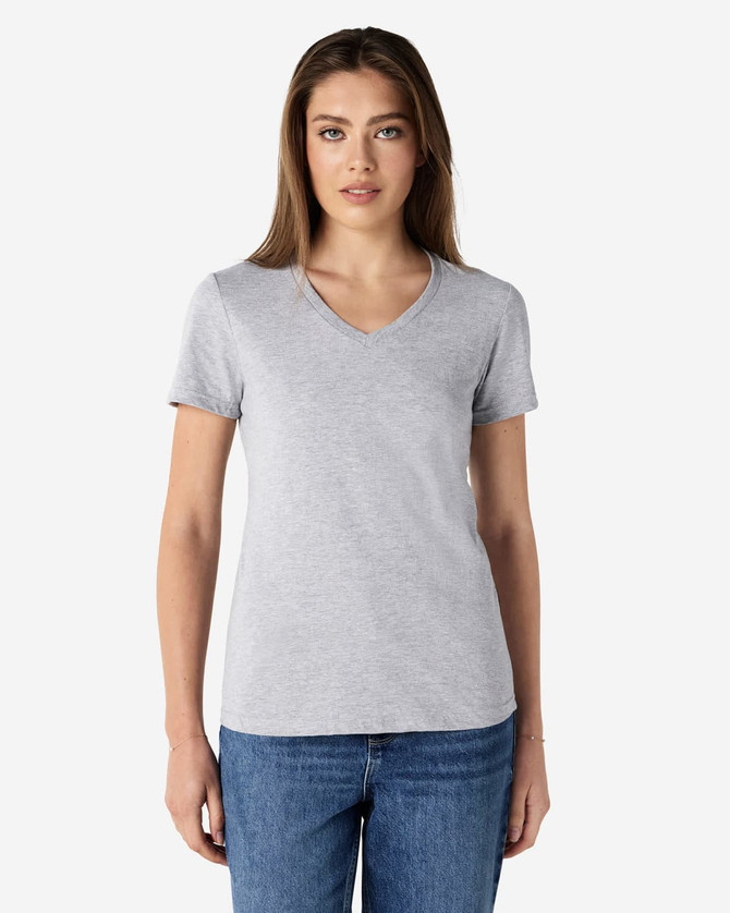 A grey Gildan Softstyle ladies' V-neck T-shirt displayed on a model, featuring a simple design and fitted silhouette.