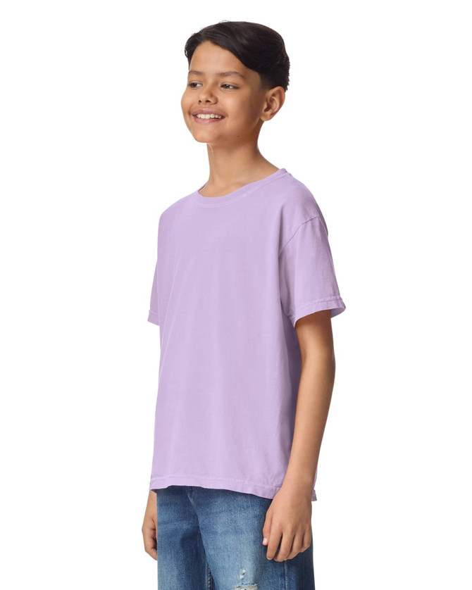 A purple short sleeve t-shirt positioned on a model, featuring a relaxed fit and simple design.