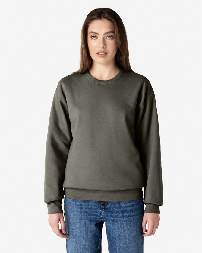 A grey Gildan Softstyle adult sweatshirt displayed on a model, featuring long sleeves and a crew neck.