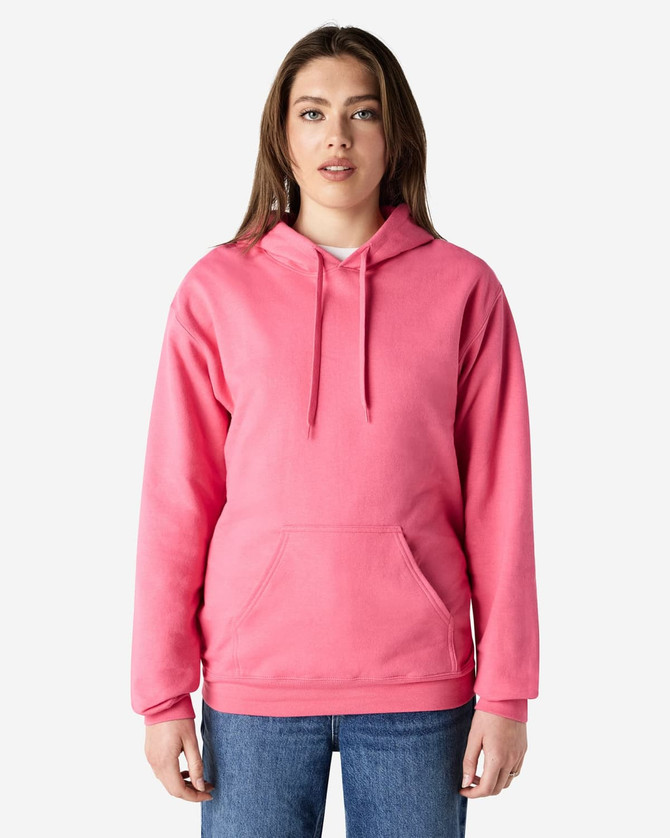 A pink hooded sweatshirt with a front pocket and drawstring hood, worn by a model. Features a branding logo.