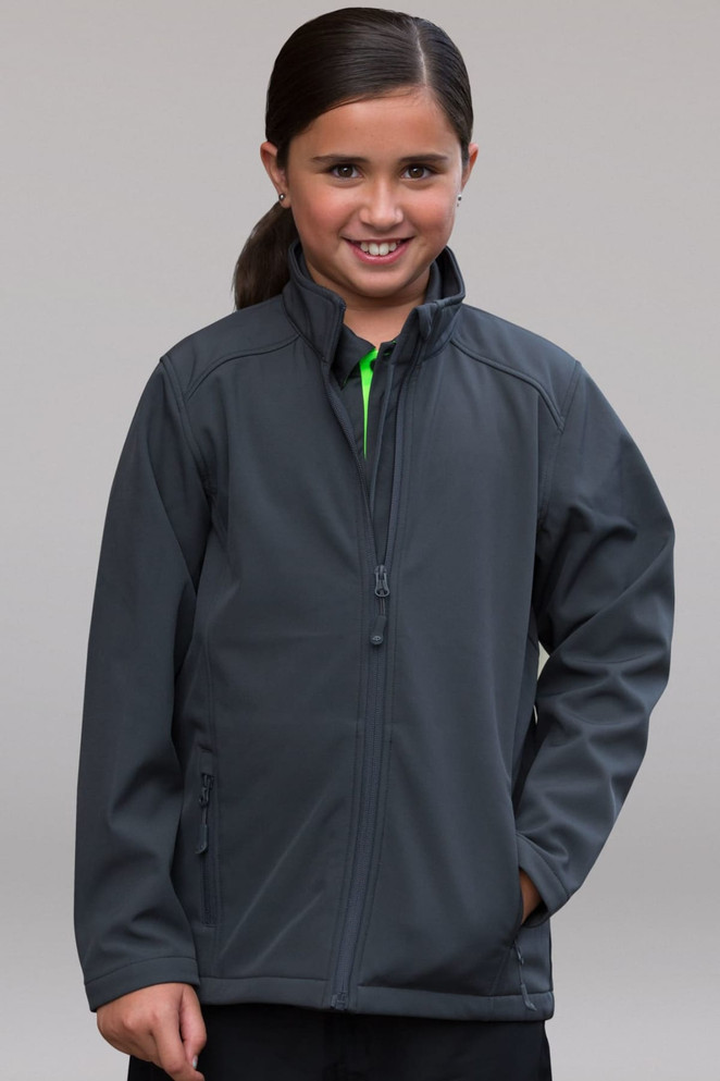 A girls' soft shell jacket in grey, featuring a zip front and a close-fitting collar, with a logo on the chest.