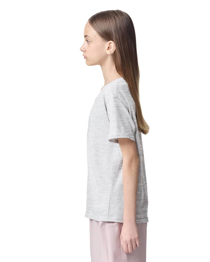 A grey youth t-shirt displayed on a model from the side, featuring short sleeves and a simple design.