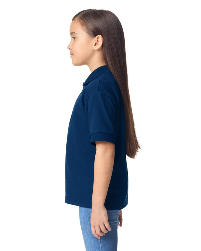 A navy blue youth polo shirt displayed on a girl with long hair, shown in profile. The shirt features a collar and short sleeves.
