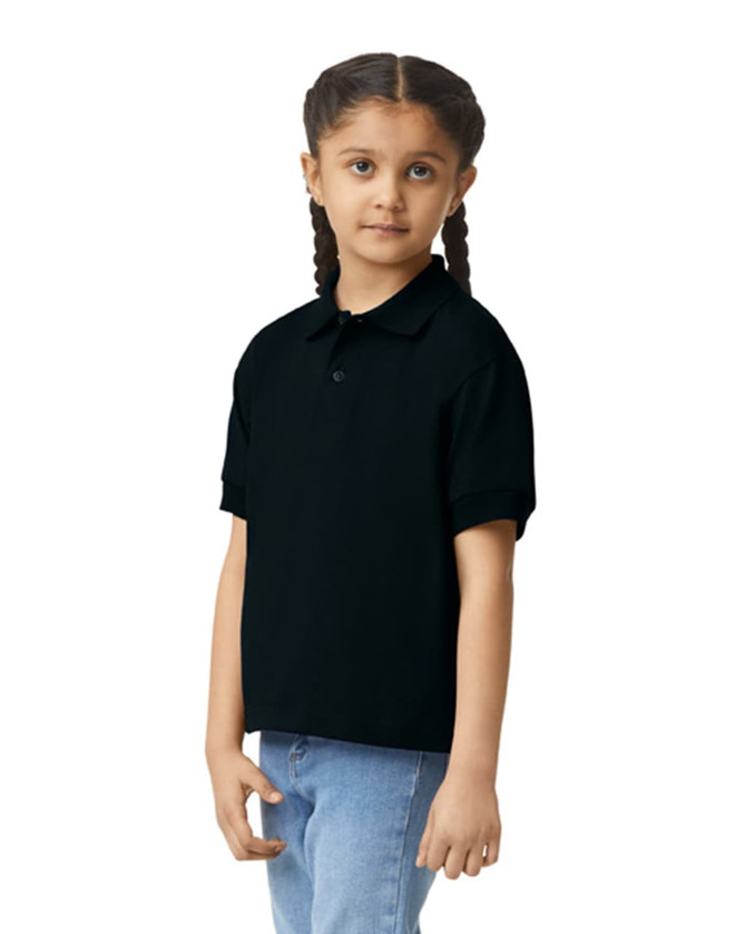 A black Gildan youth polo shirt displayed on a girl, featuring a collar and short sleeves.