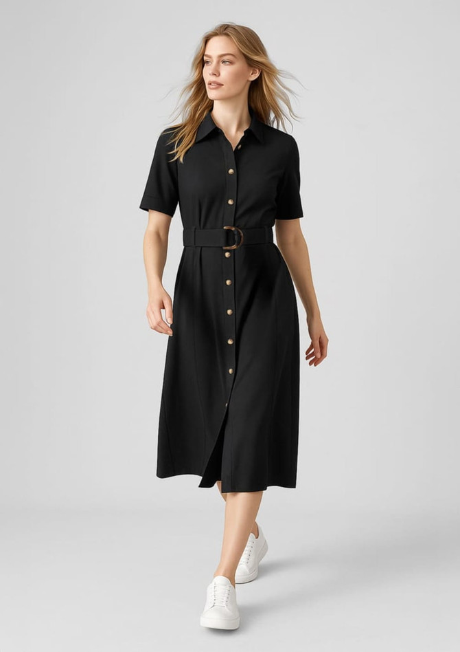A black midi dress featuring a button-down front and a belted waist, paired with white sneakers.