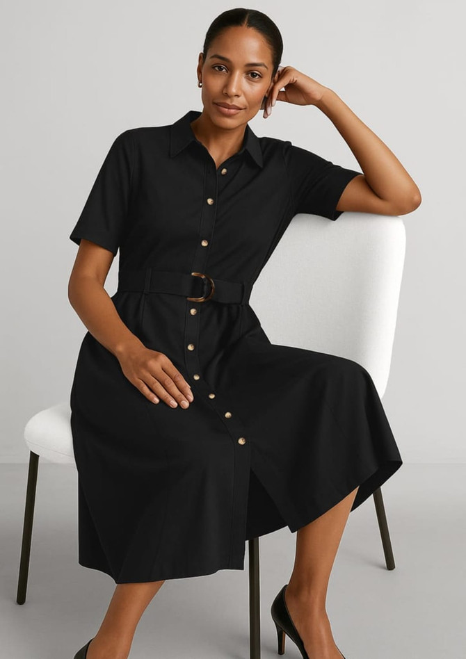 A black midi dress with short sleeves, a belted waist, and button details, displayed on a seated model.