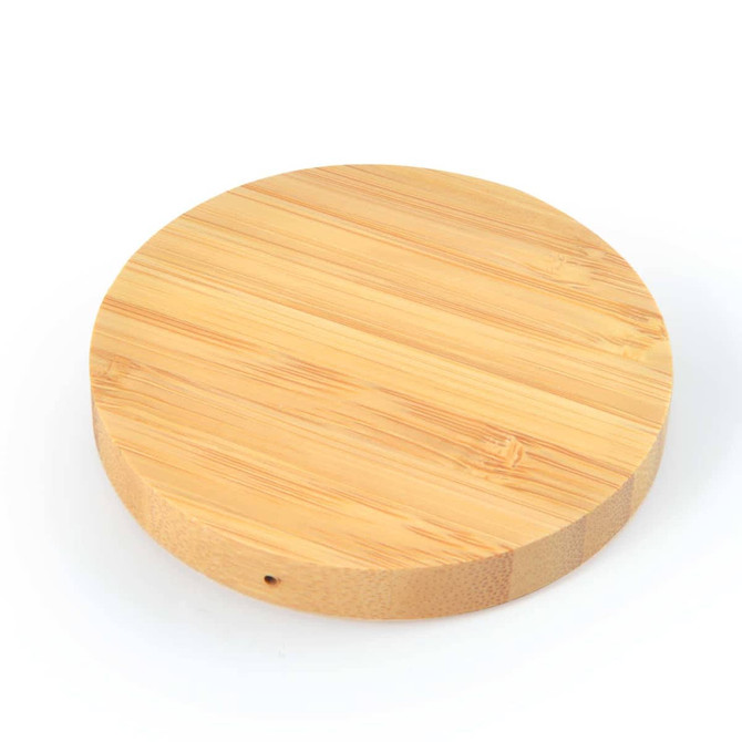 A round bamboo wireless charger featuring a smooth, natural wood finish.