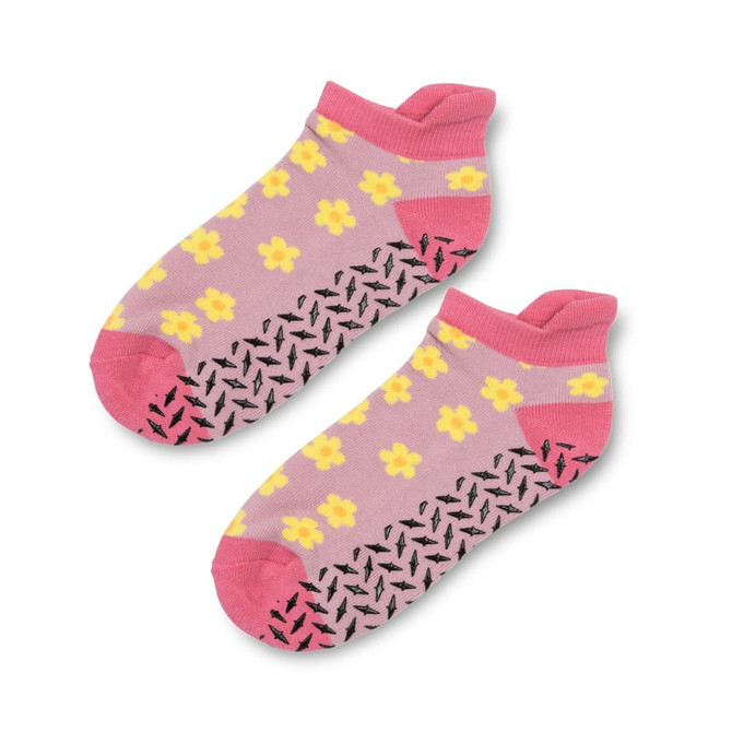 Ankle grip socks in pink with yellow floral patterns and black anti-slip soles. Features a logo on the side.