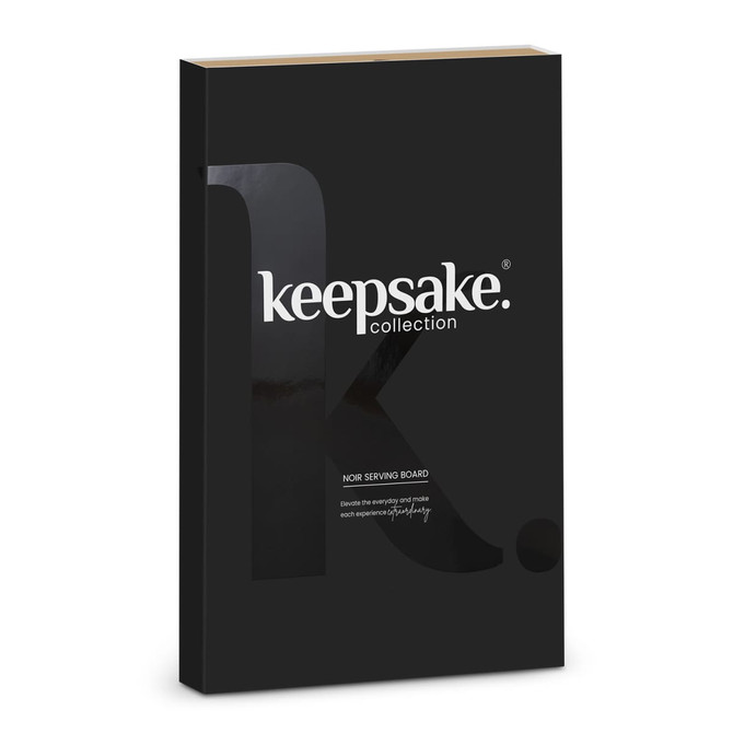A black box featuring the Keepsake Noir Serving Board, with minimalist branding on the front.