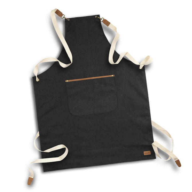 A black canvas apron with cream-coloured straps and a pocket at the front. Features a logo on the bottom corner.