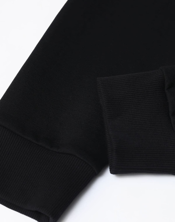 A black unisex crew neck sweater featuring airlayered CVC fabric with ribbed cuffs. It has a logo on the design.