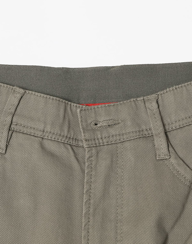 A pair of men's flexi chino pants in a light grey colour, featuring a button closure and pockets.