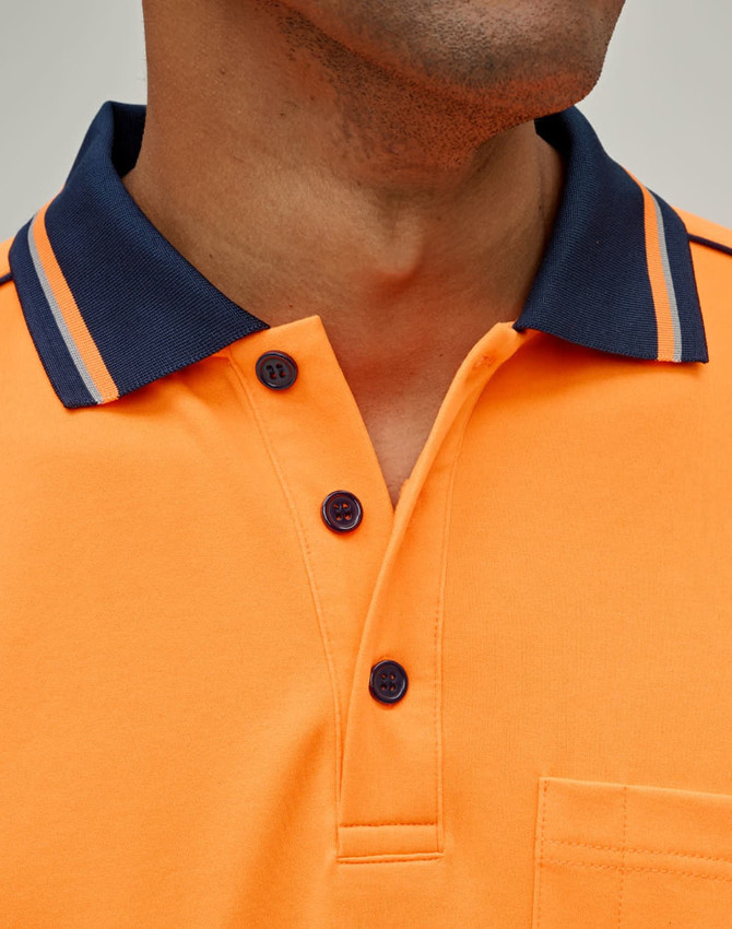 An orange long-sleeve polo shirt features a navy collar and button detailing, along with a pocket.