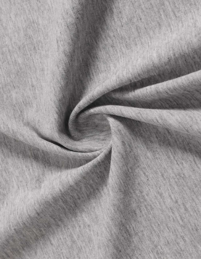 A close-up of light grey cotton fabric, showing a soft, textured appearance and the material's weave.