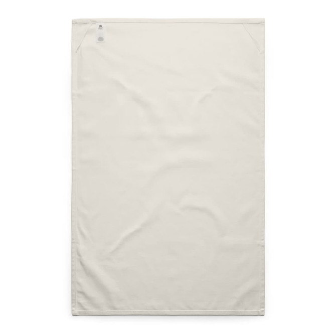 A cream tea towel featuring a simple design and a logo in the corner. It has a smooth, textured surface.