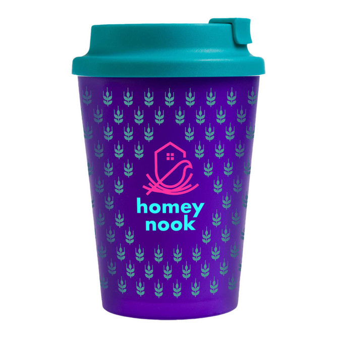 A reusable purple coffee cup with a teal lid and a logo, featuring a patterned design.