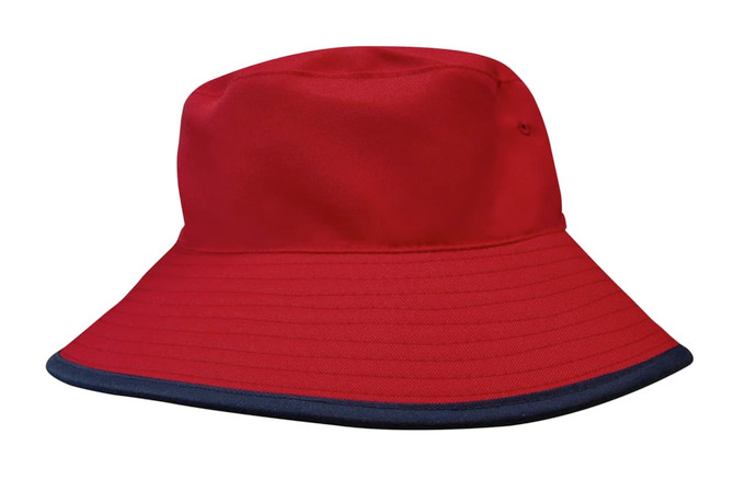 A reversible bucket hat in red with a navy blue brim, featuring branding. Made from breathable poly twill fabric.
