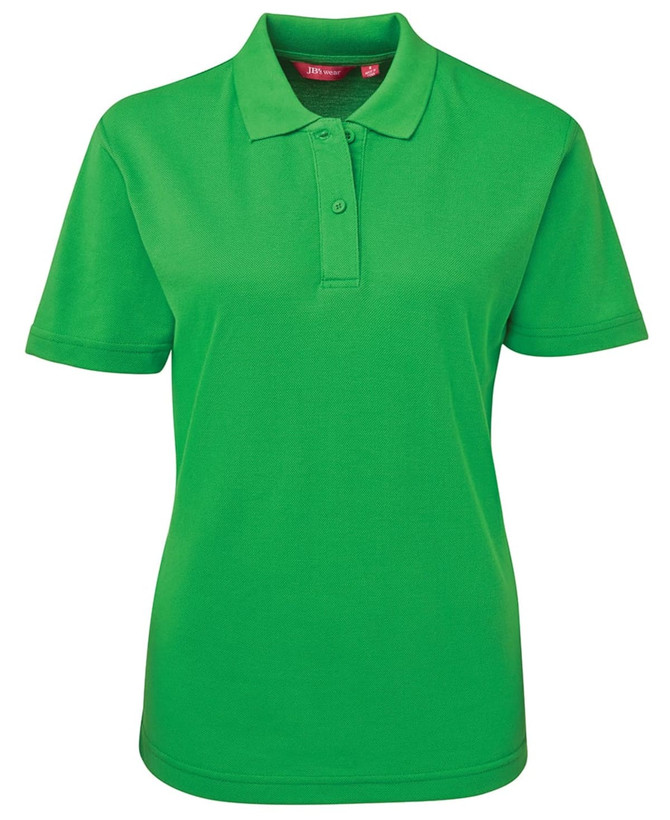 A green ladies' polo shirt featuring a collar and short sleeves, with a logo on the chest area.